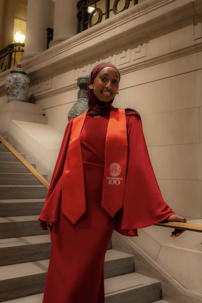 A photo of Maha Sidi looking off to the side.